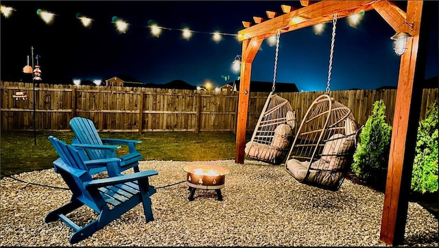 2504 Maplewood Ave, Lowell, AR 72745 - fenced backyard with a fire pit