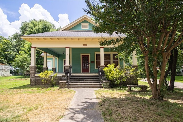 501 Fillmore St, Clarksville, AR 72830 - view of front of house featuring a porch, a shingled roof, and a front yard