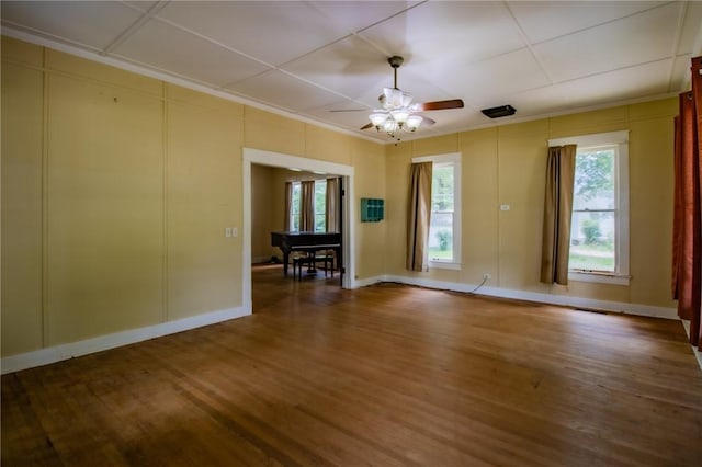 501 Fillmore St, Clarksville, AR 72830 - empty room with ornamental molding, ceiling fan, plenty of natural light, and wood finished floors