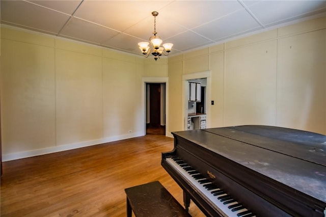 501 Fillmore St, Clarksville, AR 72830 - living area with a chandelier, light wood finished floors, and a decorative wall