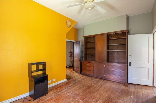 501 Fillmore St, Clarksville, AR 72830 - unfurnished bedroom with wood finished floors and a ceiling fan