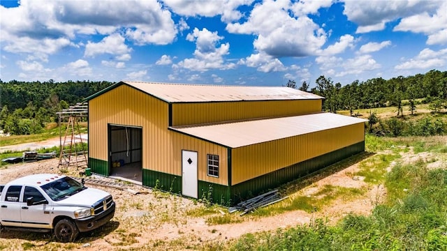 22842 Carlton Dr, Decatur, AR 72722 - view of side of home featuring an outbuilding and a metal roof