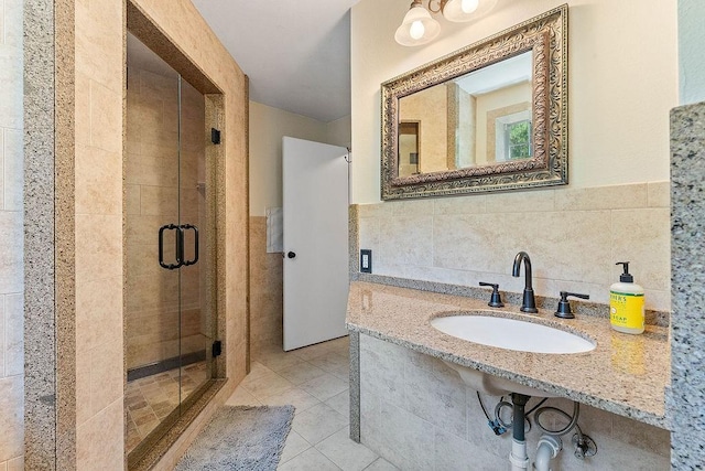 3389 Madison Unit 2405, Huntsville, AR 72740 - full bath with tile walls, a shower stall, tile patterned floors, and wainscoting
