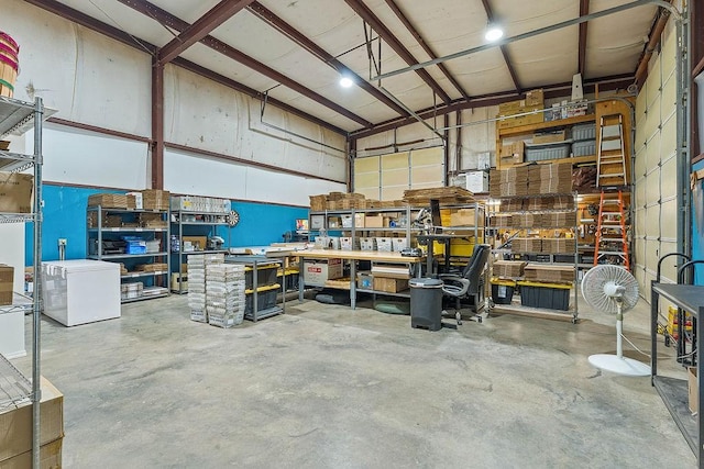 3389 Madison Unit 2405, Huntsville, AR 72740 - garage featuring a workshop area and refrigerator