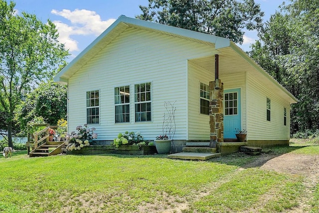 3389 Madison Unit 2405, Huntsville, AR 72740 - back of property featuring a lawn and entry steps