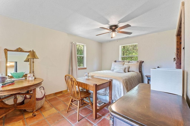 3389 Madison Unit 2405, Huntsville, AR 72740 - bedroom featuring a textured ceiling, light tile patterned floors, and ceiling fan