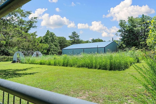 3389 Madison Unit 2405, Huntsville, AR 72740 - view of grassy yard featuring an outbuilding and an outdoor structure