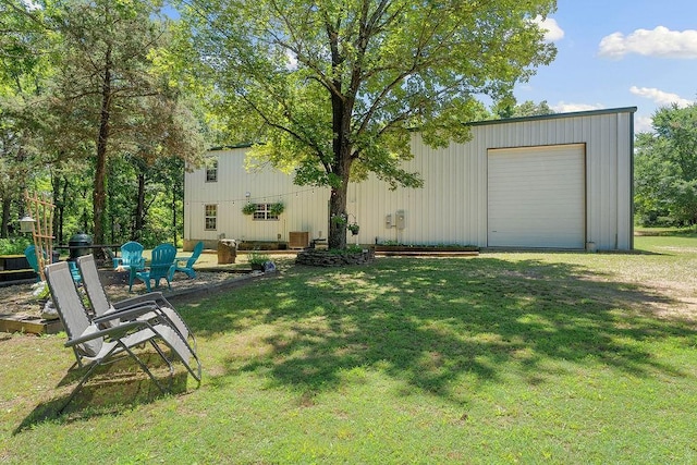3389 Madison Unit 2405, Huntsville, AR 72740 - view of green lawn with an outdoor structure and a detached garage