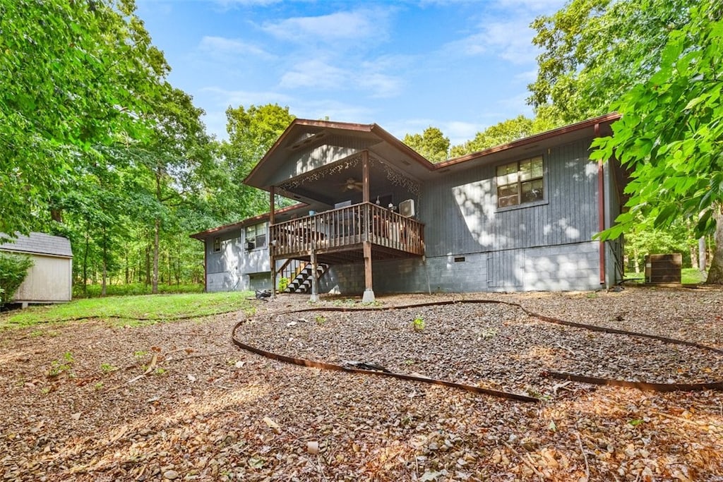 8 Kenilworth Dr, Bella Vista, AR 72714 - back of house featuring a ceiling fan, a deck, stairway, and crawl space