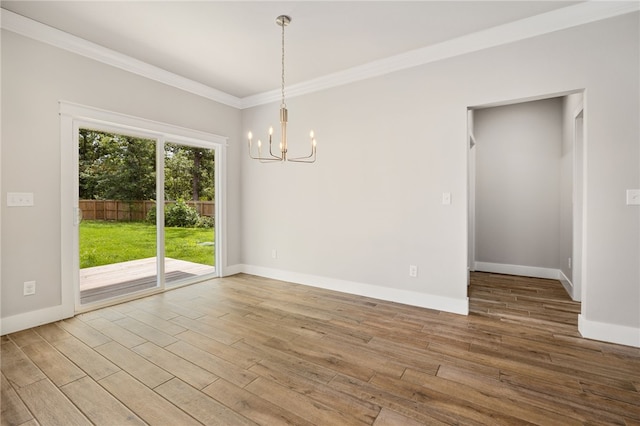 20 Dirleton Dr, Bella Vista, AR 72715 - empty room with a chandelier, ornamental molding, and wood finished floors