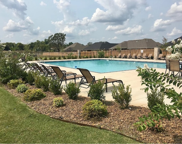 1052 Morra Ave, Tontitown, AR 72762 - community pool featuring a patio area