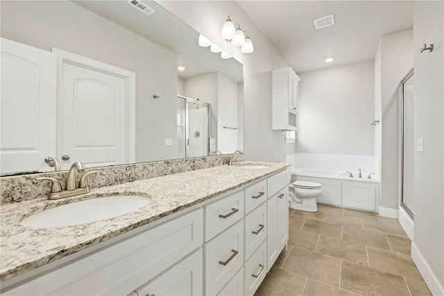 1052 Morra Ave, Tontitown, AR 72762 - full bath featuring a shower stall, double vanity, a bath, and recessed lighting