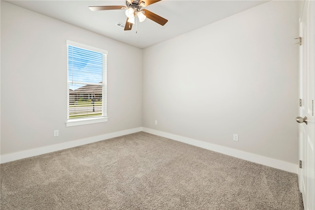 1052 Morra Ave, Tontitown, AR 72762 - carpeted spare room featuring baseboards and ceiling fan