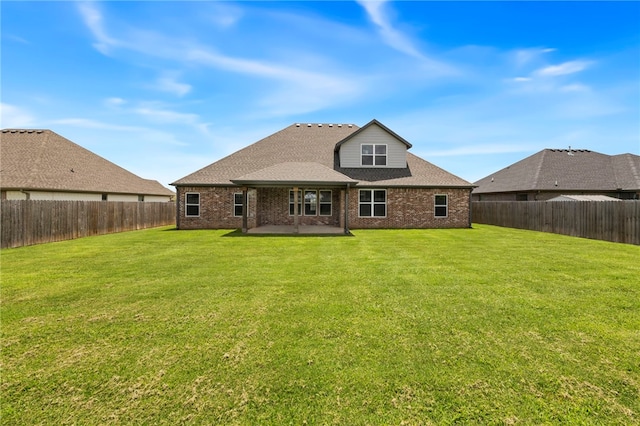 1052 Morra Ave, Tontitown, AR 72762 - rear view of property featuring a patio area, brick siding, a fenced backyard, and a shingled roof