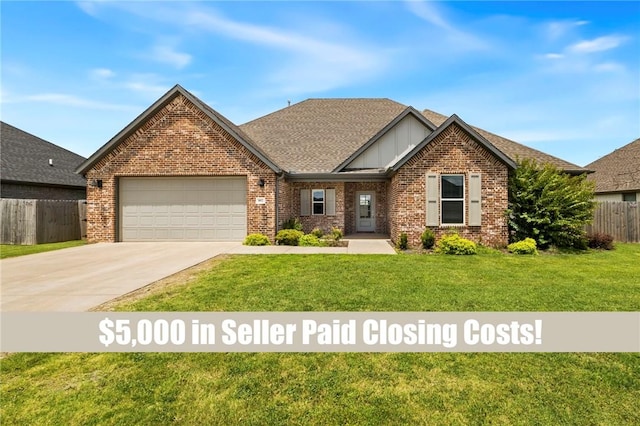 1052 Morra Ave, Tontitown, AR 72762 - view of front of home featuring a garage, brick siding, driveway, and a shingled roof