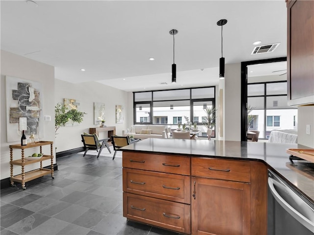 401 W Watson St Unit 507, Fayetteville, AR 72701 - kitchen with stainless steel dishwasher, open floor plan, brown cabinetry, a peninsula, and dark countertops