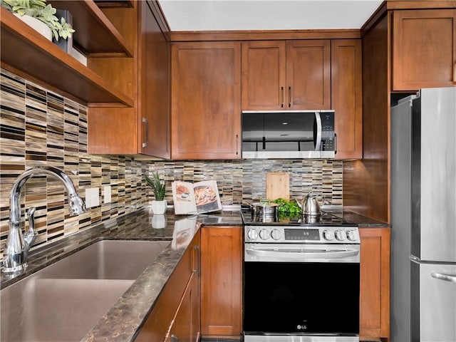401 W Watson St Unit 507, Fayetteville, AR 72701 - kitchen featuring stainless steel appliances, brown cabinetry, backsplash, and open shelves