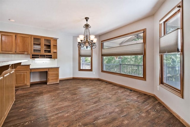 1 May Ln, Bella Vista, AR 72715 - kitchen with built in desk, plenty of natural light, and dark wood-type flooring