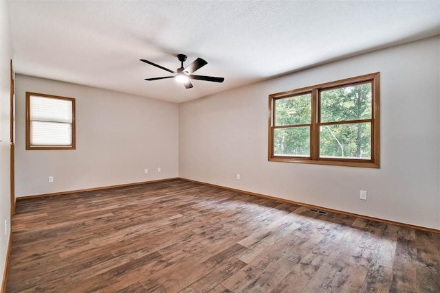 1 May Ln, Bella Vista, AR 72715 - spare room with healthy amount of natural light, wood finished floors, and ceiling fan