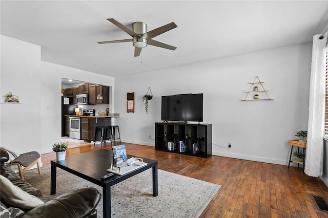 1115-1117 S Ellis Ave, Fayetteville, AR 72701 - living area with ceiling fan and wood-type flooring