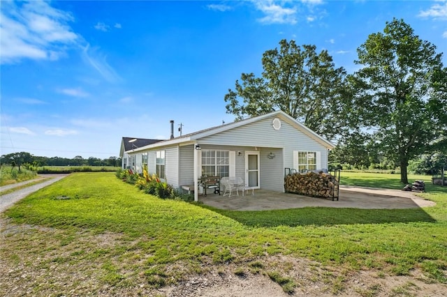 13183 Shady Grove Rd, Gravette, AR 72736 - back of property with a patio area and a lawn