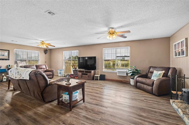 13183 Shady Grove Rd, Gravette, AR 72736 - living area with ceiling fan, wood finished floors, and a textured ceiling