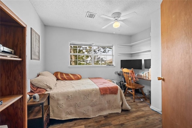 13183 Shady Grove Rd, Gravette, AR 72736 - bedroom featuring wood finished floors, a textured ceiling, and ceiling fan