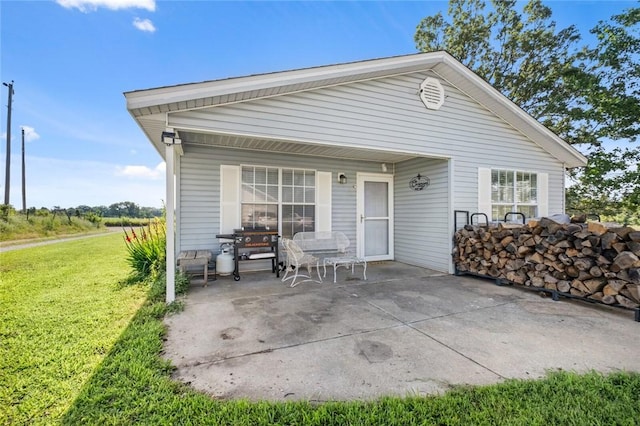 13183 Shady Grove Rd, Gravette, AR 72736 - back of property featuring a patio area and a yard