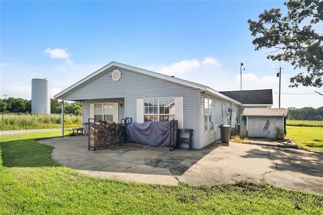 13183 Shady Grove Rd, Gravette, AR 72736 - rear view of house featuring a yard and a patio