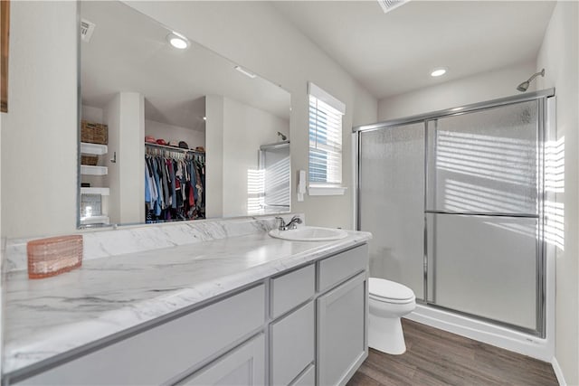 3461 Red Tail Way, Farmington, AR 72730 - full bath featuring vanity, a shower stall, wood finished floors, and a spacious closet