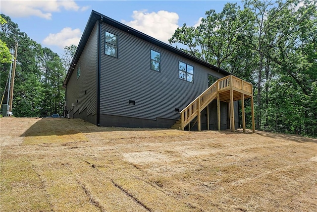 17 Westmorland Dr, Bella Vista, AR 72714 - back of house with a wooden deck, stairway, and crawl space