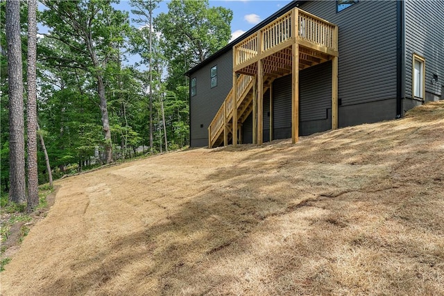 17 Westmorland Dr, Bella Vista, AR 72714 - rear view of property with a wooden deck and stairway