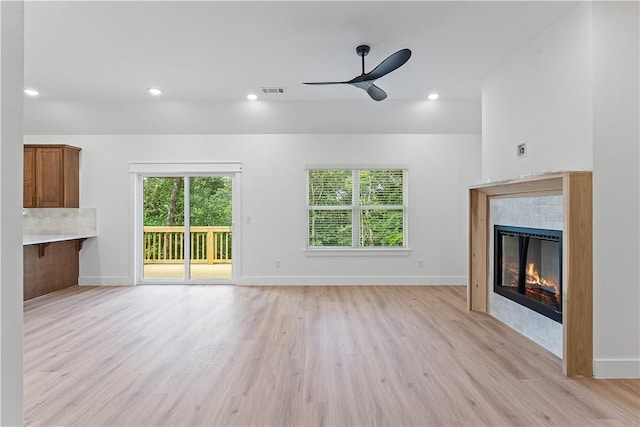 127 Overton Dr, Bella Vista, AR 72714 - unfurnished living room featuring light wood finished floors, ceiling fan, a fireplace, and recessed lighting