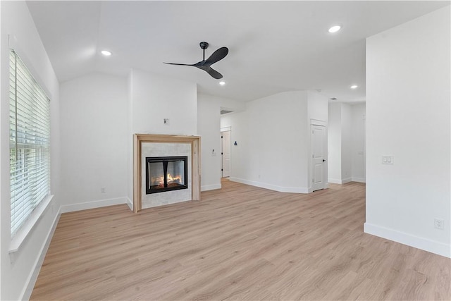 127 Overton Dr, Bella Vista, AR 72714 - unfurnished living room featuring ceiling fan, recessed lighting, light wood finished floors, vaulted ceiling, and a fireplace