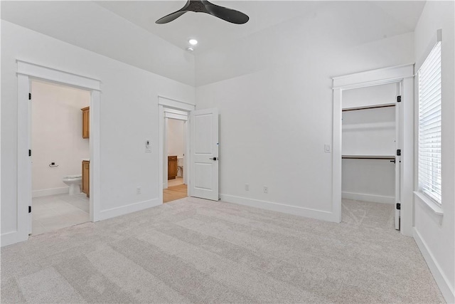 127 Overton Dr, Bella Vista, AR 72714 - unfurnished bedroom with carpet flooring, a spacious closet, and multiple windows
