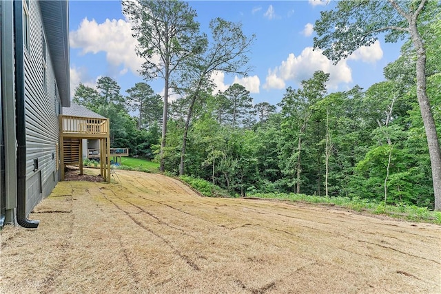 127 Overton Dr, Bella Vista, AR 72714 - view of yard with a deck and a forest view