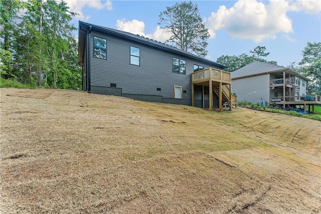 127 Overton Dr, Bella Vista, AR 72714 - back of house with stairway and a wooden deck
