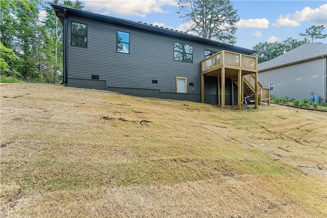 127 Overton Dr, Bella Vista, AR 72714 - rear view of house featuring stairs, a wooden deck, and a lawn