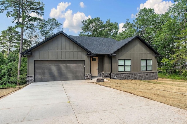 127 Overton Dr, Bella Vista, AR 72714 - view of front of house with brick siding, a garage, concrete driveway, and a shingled roof