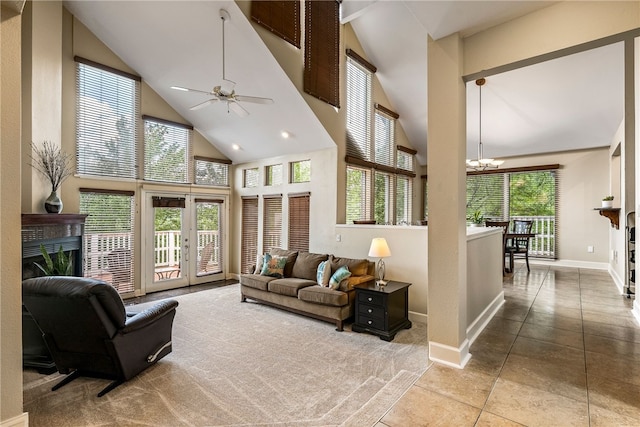 2855 E Hyland Park Rd, Fayetteville, AR 72701 - living area featuring high vaulted ceiling, a high end fireplace, a chandelier, and ceiling fan
