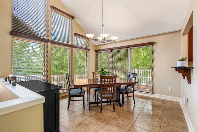 2855 E Hyland Park Rd, Fayetteville, AR 72701 - dining room with plenty of natural light, a chandelier, light tile patterned floors, and high vaulted ceiling