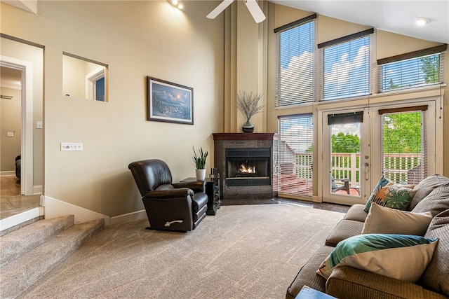 2855 E Hyland Park Rd, Fayetteville, AR 72701 - living room featuring carpet, a fireplace, a high ceiling, and ceiling fan