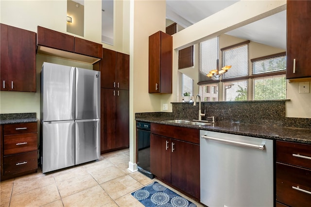 2855 E Hyland Park Rd, Fayetteville, AR 72701 - kitchen with freestanding refrigerator, dishwashing machine, dark stone countertops, light tile patterned floors, and lofted ceiling
