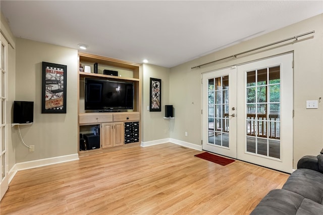 2855 E Hyland Park Rd, Fayetteville, AR 72701 - unfurnished living room with french doors, light wood finished floors, and recessed lighting