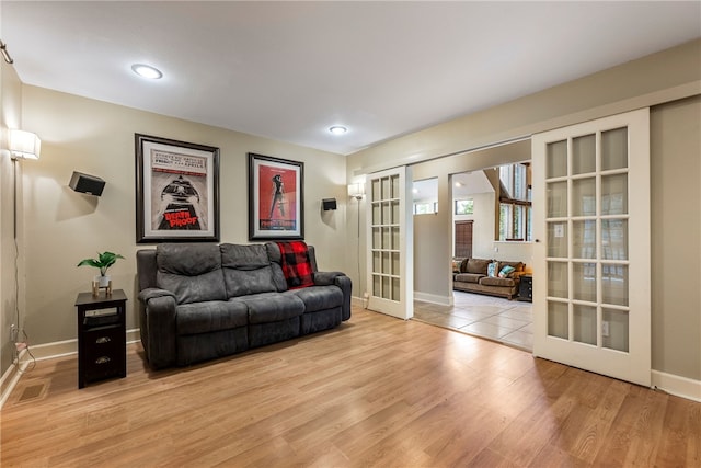 2855 E Hyland Park Rd, Fayetteville, AR 72701 - living area with french doors, light wood-style floors, and recessed lighting