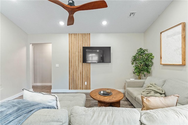 2905 NE 12th St, Bentonville, AR 72712 - living room featuring wood finished floors, recessed lighting, ceiling fan, and a textured ceiling
