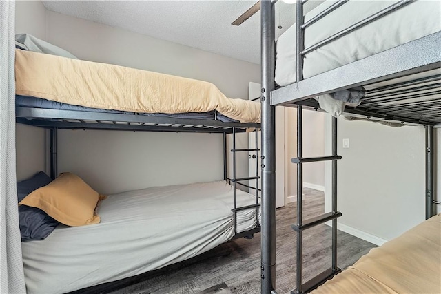 2905 NE 12th St, Bentonville, AR 72712 - bedroom with wood finished floors and ceiling fan