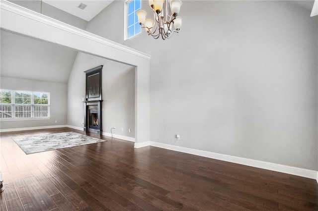 3915 Baltic St, Springdale, AR 72762 - unfurnished living room featuring a chandelier, dark wood-style flooring, a lit fireplace, and high vaulted ceiling