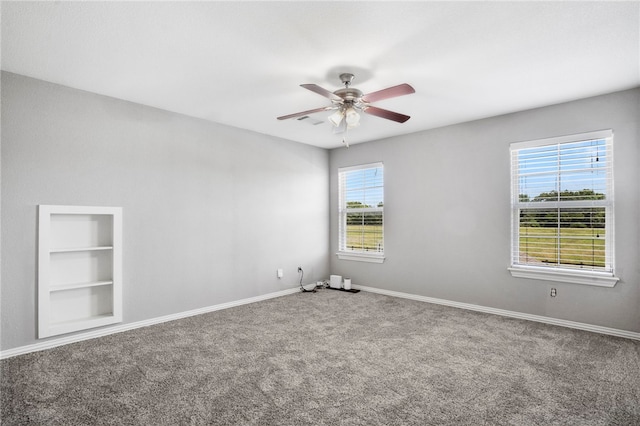 3915 Baltic St, Springdale, AR 72762 - unfurnished room featuring plenty of natural light, carpet flooring, and ceiling fan