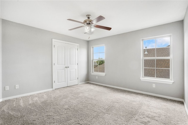 3915 Baltic St, Springdale, AR 72762 - unfurnished bedroom with carpet flooring, a closet, and a ceiling fan